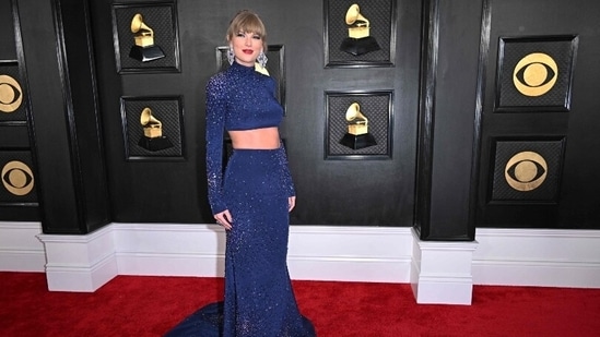 Taylor Swift looked pretty in a blue sequined co-ord set featuring midriff-baring details. In statement diamond earrings, Taylor looked every bit stunning.&nbsp;(AFP)