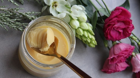 Ghee: For people with dry skin, one of the most common symptoms is flaking skin. Ghee-based body butters and oils reach the skin's deepest layers and hydrate the skin from within. The molecules of Ghee are reduced in size with each wash, making it easier for the skin to absorb and feel smoother. Rich in nutrients, it hydrates skin to the brim and fights the signs of aging. This contributes to 24-hour hydration. Ghee-based products not only soften and moisturise the skin but also give it a healthy glow.(Photo by Megumi Nachev on Unsplash)