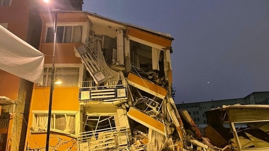 A collapsed building is seen following an earthquake in Pazarcik, in Kahramanmaras province, southern Turkey, early Monday.(AP)