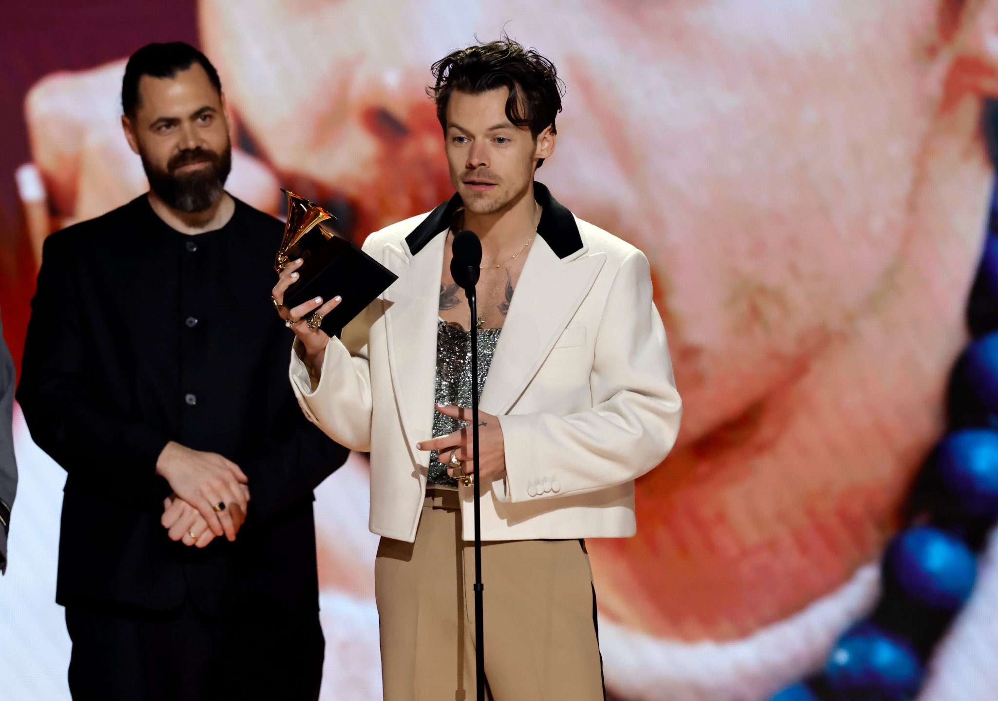 Harry Styles receives the award. Harry Styles receives the award.