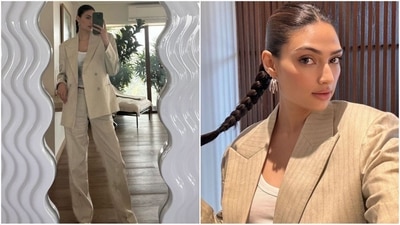 Athiya Shetty has impressed her fans once more by giving a vintage Suniel Shetty suit a modern twist. The timeless beige suit, adorned with horizontal stripes, is now paired with a classic white tank top and retro canvas shoes, showcasing her unique fashion sense. (Instagram) Athiya Shetty has impressed her fans once more by giving a vintage Suniel Shetty suit a modern twist. The timeless beige suit, adorned with horizontal stripes, is now paired with a classic white tank top and retro canvas shoes, showcasing her unique fashion sense. (Instagram)