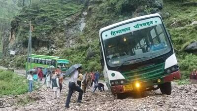 A Himachal Road Transport Corporation (HRTC) bus stuck in debris following a flashflood after heavy rain at Talehan in Karsog sub division of Mandi district on Thursday. (HT Photo) A Himachal Road Transport Corporation (HRTC) bus stuck in debris following a flashflood after heavy rain at Talehan in Karsog sub division of Mandi district on Thursday. (HT Photo)