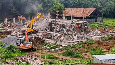 An under-construction central office of YSR Congress Party (YSRCP) is being demolished by the Andhra Pradesh Capital Region Development Authority, at Tadepalle, in the Guntur district of Andhra Pradesh on June 22. (ANI)