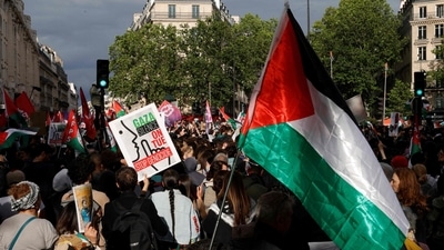 Representative Image: Four pro Palestine protesters were arrested for climbing the roof of Australia's Parliament House and waving the Palestinian flag for an hour (AFP) Representative Image: Four pro Palestine protesters were arrested for climbing the roof of Australia's Parliament House and waving the Palestinian flag for an hour (AFP)