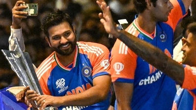 Rohit Sharma cannot let go the T20 World Cup trophy (AFP) Rohit Sharma cannot let go the T20 World Cup trophy (AFP)