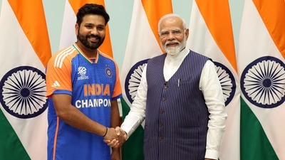 The players even got individual photos with PM Modi. Here is a photo of Rohit Sharma posing with PM Modi. (AFP) The players even got individual photos with PM Modi. Here is a photo of Rohit Sharma posing with PM Modi. (AFP)