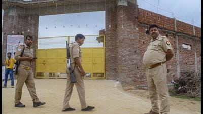 Mainpuri: Police personnel outside Ram Kutir Charitable Trust, the ashram of preacher Baba Narayan Hari, also known as Saakar Vishwa Hari Bhole Baba, at Bichhwa, in Mainpuri district on July 3 (PTI) Mainpuri: Police personnel outside Ram Kutir Charitable Trust, the ashram of preacher Baba Narayan Hari, also known as Saakar Vishwa Hari Bhole Baba, at Bichhwa, in Mainpuri district on July 3 (PTI)