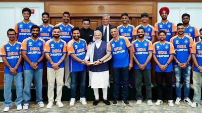 Prime Minister Narendra Modi with Indian cricket team in New Delhi on Thursday. (AFP) Prime Minister Narendra Modi with Indian cricket team in New Delhi on Thursday. (AFP)