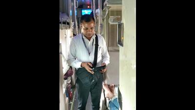 Railway employee checking passengers for tickets in a train in Ludhiana on Thursday. (HT Photo)