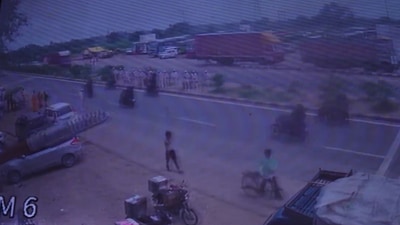 The footage shows several volunteers, also known as ‘Sevak’, standing on both sides of the road as Bhole Baba's convoy crosses (PTI) The footage shows several volunteers, also known as ‘Sevak’, standing on both sides of the road as Bhole Baba's convoy crosses (PTI)