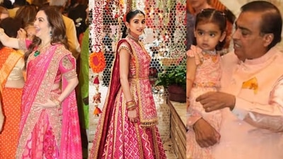 Nita Ambani, Mukesh and Radhika all look resplendent as they celebrate at Antilia. Nita Ambani, Mukesh and Radhika all look resplendent as they celebrate at Antilia.
