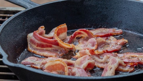Bacon makes for the perfect addition to Caesar salads (Unsplash)