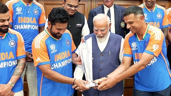 Prime Minister Narendra Modi with Rahul Dravid, Rohit Sharma and the ICC T20 Mens World Cup 2024 trophy, in New Delhi 

