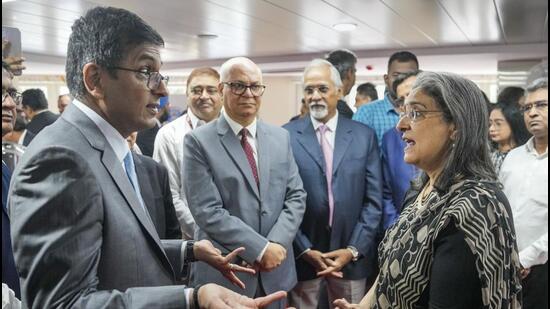 Latest news on July 4, 2024: Chief Justice of India DY Chandrachud speaking with SEBI chairperson Madhabi Puri Buch at the inauguration of new office premises of Securities Appellate Tribunal in Mumbai on Thursday. (PTI)