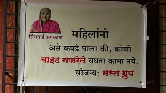 A poster, written in Marathi, urges women to dress modestly.