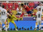 Spain's Mikel Merino, centre, scores his side's second goal during a quarter final match between Germany and Spain at the Euro 2024 soccer tournament in Stuttgart, Germany, Friday, July 5, 2024.