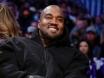 FILE - Kanye West, known as Ye, watches the first half of an NBA basketball game between the Washington Wizards and the Los Angeles Lakers, on March 11, 2022, in Los Angeles. Adidas said Wednesday March 13, 2024 that it's donated or is planning to give away more than $150 million to groups fighting antisemitism and other forms of hate from the sales of Yeezy shoes last year after it severed ties with Ye, the rapper formerly known as Kanye West. (AP Photo/Ashley Landis, File) FILE - Kanye West, known as Ye, watches the first half of an NBA basketball game between the Washington Wizards and the Los Angeles Lakers, on March 11, 2022, in Los Angeles. Adidas said Wednesday March 13, 2024 that it's donated or is planning to give away more than $150 million to groups fighting antisemitism and other forms of hate from the sales of Yeezy shoes last year after it severed ties with Ye, the rapper formerly known as Kanye West. (AP Photo/Ashley Landis, File)