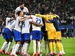 France's players celebrate after winning the final penalty shootout.
