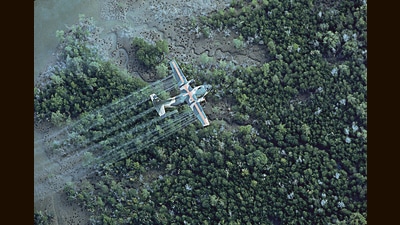 A US Air Force plane sprays Agent Orange over a neighbourhood in Vietnam. This toxin wreaked havoc because of a dioxin it contained. (Getty Images) A US Air Force plane sprays Agent Orange over a neighbourhood in Vietnam. This toxin wreaked havoc because of a dioxin it contained. (Getty Images)