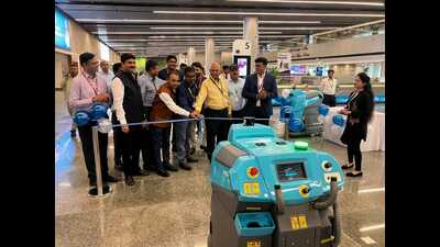 CCSI airport officials operating the cleaning robots. (Sourced)