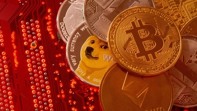 Representations of cryptocurrencies Bitcoin, Ethereum, DogeCoin, Ripple, Litecoin are seen. Bitcoin hit an all-time peak of $73,798 in March, buoyed by unexpectedly strong demand for inaugural US ETFs for the token. (Reuters)