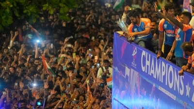 Rohit Sharma with the T20 World Cup trophy on the open-top bus during the parade (PTI) Rohit Sharma with the T20 World Cup trophy on the open-top bus during the parade (PTI)