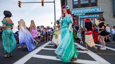 Costumed people dressed as Disney princesses march in the Fishtown Horribles Parade ahead of Independence Day in Gloucester, Massachusetts, on July 3, 2024. The parade is part of the city's July 4th celebrations. (AFP/ Joseph Prezioso) Costumed people dressed as Disney princesses march in the Fishtown Horribles Parade ahead of Independence Day in Gloucester, Massachusetts, on July 3, 2024. The parade is part of the city's July 4th celebrations. (AFP/ Joseph Prezioso)