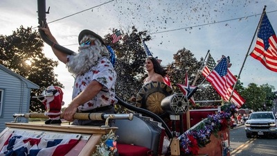 People dressed as Santa Claus and Wonder Woman spray fake snow on attendees as they ride in the Fishtown Horribles Parade ahead of Independence Day in Gloucester, Massachusetts, on July 3, 2024. The parade is part of the city's July 4th celebrations. (AFP/Joseph Prezioso) People dressed as Santa Claus and Wonder Woman spray fake snow on attendees as they ride in the Fishtown Horribles Parade ahead of Independence Day in Gloucester, Massachusetts, on July 3, 2024. The parade is part of the city's July 4th celebrations. (AFP/Joseph Prezioso)