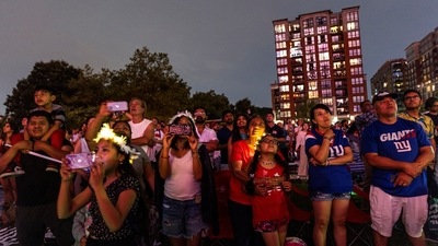 People watch the Macy's 4th of July Firework Show over the Hudson River, from Hoboken, New Jersey, U.S., July 4, 2024.&nbsp; (REUTERS/Eduardo Munoz)