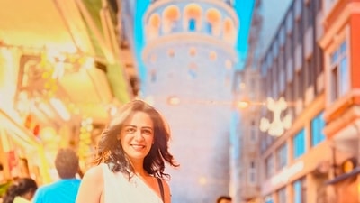 Mona poses for a photo with the famous Galata Tower in the background. Mona poses for a photo with the famous Galata Tower in the background.