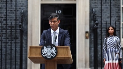 Britain's outgoing Prime Minister and leader of the Conservative party, Rishi Sunak, delivers a statement after his general election defeat outside 10 Downing Street in London as his wife, Akshata Murty, stands at a distance. (AFP) Britain's outgoing Prime Minister and leader of the Conservative party, Rishi Sunak, delivers a statement after his general election defeat outside 10 Downing Street in London as his wife, Akshata Murty, stands at a distance. (AFP)