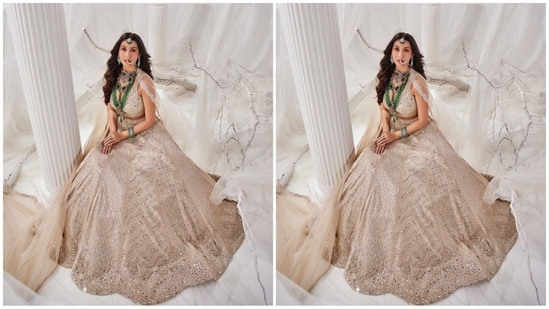 She accessorised her ethnic look with green emerald jewellery, including multiple layered necklaces, statement earrings, a nose ring, a maang tikka, stacked bracelets adorning her wrist, and rings on her fingers.(Instagram/@norafatehi)