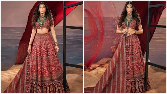 Nora's red lehenga from JJ Valaya serves serious bridal fashion goals. It features a deep V-neck blouse adorned with intricate golden hand embroidery. She paired it with a matching flared skirt and a dupatta with heavy borders.(Instagram/@norafatehi)