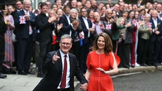 Britain's Prime Minister Keir Starmer and leader of the Labour Party, and his wife Victoria thank supporters after he addressed the nation following his general election victory, in Downing Street in London on Friday. (AFP)