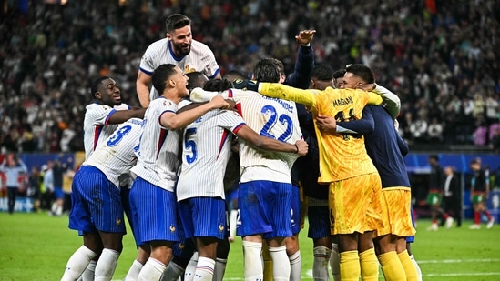 France's players celebrate after winning the final penalty shootout.