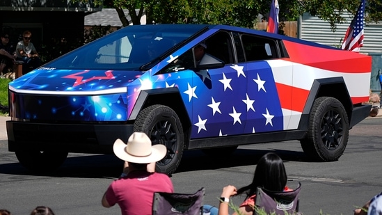 A Tesla Cybertruck wrapped in a patriotic motif takes part in the Colorado 4th at Firestone parade to mark the Independence Day holiday Thursday, July 4, 2024, in Firestone, Colo. Floats, marching bands, classic cars and motorcycles were features in the annual parade through the Weld County community north of Denver. (AP Photo/)(AP/David Zalubowski)