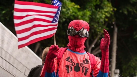 A person dressed as Spider-Man celebrates Independence Day at the annual Santa Monica 4th of July parade in Santa Monica, Calif., on Thursday, July 4, 2024.(AP/Damian Dovarganes)