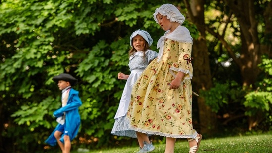 Children dressed in colonial outfits wait for the festivities to begin during the Fishtown Horribles Parade, ahead of Independence Day, in Gloucester, Massachusetts on July 3, 2024. The parade is part of the city's July 4th celebrations.&nbsp;(AFP/Joseph Prezioso)