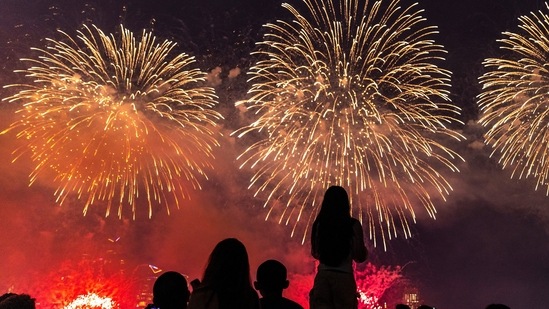 People watch the Macy's 4th of July Firework Show over the Hudson River, with the New York City skyline, from Hoboken, New Jersey, U.S., July 4, 2024.&nbsp;(REUTERS/Eduardo Munoz)