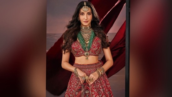 With the help of hairstylist Aamir Khan, Nora styled her long, lustrous tresses into soft curls, leaving them open with a middle part. The cascading curls beautifully complemented her chic look, enhancing her overall elegance.(Instagram/@norafatehi)
