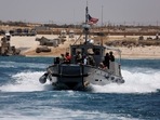 An American boat carrying American soldiers and journalist sails near the Trident Pier, a temporary pier to deliver aid, off the Gaza Strip, amid the ongoing conflict between Israel and Hamas, near the Gaza coast, June 25, 2024. REUTERS/Amir Cohen     TPX IMAGES OF THE DAY