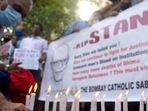 Mumbai, India - July 06, 2021: Members of The Bombay Catholic Sabha hold a memorial mass outside St. Peter's Church in Bandra in protest holding banners and lighting candles for the Indian rights activist and Jesuit priest Father Stan Swamy, who was detained for nine months under Indian anti-terrorism law without trial, died on Monday ahead on his bail hearing, in Mumbai, India on Saturday, July 06, 2021. (Photo by Vijay Bate/HT Photo) (HT PHOTO)