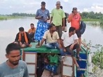 Flood-affected people move to a safer place on a boat in Nalbari district on Friday, July 5, 2024. (PTI Photo) Flood-affected people move to a safer place on a boat in Nalbari district on Friday, July 5, 2024. (PTI Photo)