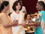 The mother and wife of Captain Anshuman Singh receive Kirti Chakra from President Droupadi Murmu on Friday.