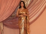 Shehnaaz Gill, in golden saree, attends Anant Ambani and Radhika Merchant's sangeet. 
