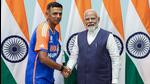 Prime Minister Narendra Modi with India head coach Rahul Dravid. (ANI)