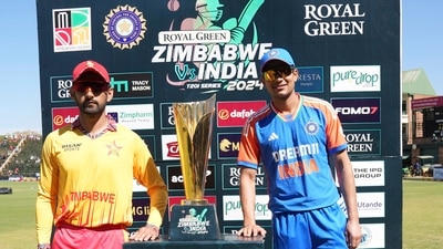 Zimbabwe cricket captain Sikandar Razar, left, and India captain Shubman Gill pose with the trophy (AP)