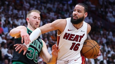 MIAMI, FLORIDA - APRIL 27: Caleb Martin #16 of the Miami Heat drives against Sam Hauser #30 of the Boston Celtics during the third quarter in game three of the Eastern Conference First Round Playoffs at Kaseya Center on April 27, 2024 in Miami, Florida. (Getty Images via AFP / Megan Briggs)