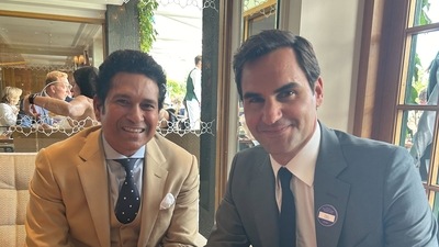 Sachin Tendulkar and Roger Federer pose for a photo together. Sachin Tendulkar and Roger Federer pose for a photo together.