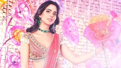 Isha accessorised the ethnic look with the same jewels as her Manish Malhotra lehenga. She wore an emerald choker, emerald dangling earrings, and diamond bracelets. (Instagram) Isha accessorised the ethnic look with the same jewels as her Manish Malhotra lehenga. She wore an emerald choker, emerald dangling earrings, and diamond bracelets. (Instagram)